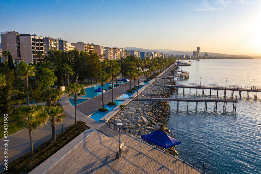 Wall mural island of cyprus. limassol. molos promenade at sunrise. the mediterranean coast in limassol district