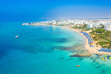 Island of Cyprus. Landscape of the Mediterranean sea. Beach holiday. Boat trips on the Mediterranean sea. Beach infrastructure. Seaside resort. Holidays in Cyprus.