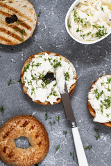 A bagel with cream cheese and microgreen