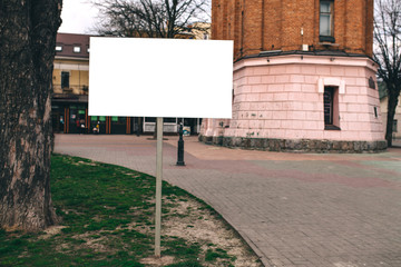 Blank mock up of street poster billboard on city background
