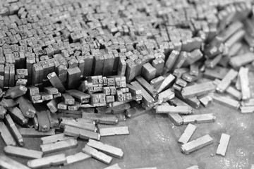 Old metal letters for printing black and white photo. Noise.