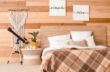Interior of modern bedroom with telescope
