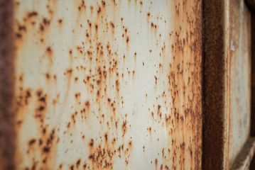 Dirty, painted metal surface with rust
