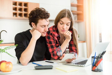 Couple calculating money. Home budget concept