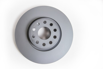 New car brake disc on a white background, close-up. copy-space.