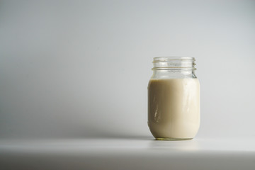 Glass jar of milk