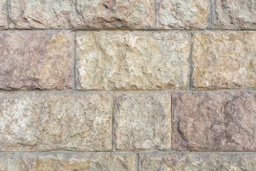 wall of large textured concrete blocks