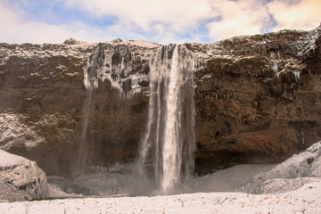 View of Seljalandsfoss waterfall in a freezing winter day, Iceland, Europe. Go explore authentic Iceland in wintertime.
