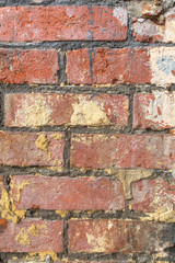 wall of very old dirty red bricks