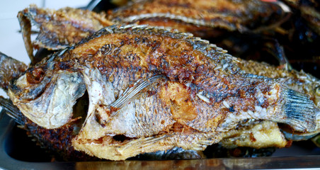 Fried Mozambique tilapia fish. Ready to eat.