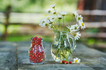 Charming still life with copy space strawberries and daisies