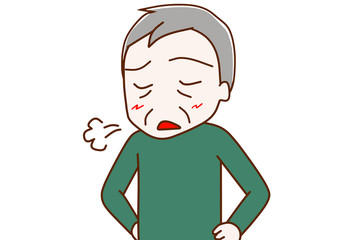 溜息をつく高齢の男性