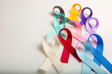 Fototapeta Multi colored cancer ribbons Proudly worn by patients, supporters and survivors for world cancer day. Bringing awareness to all types of cancer obraz