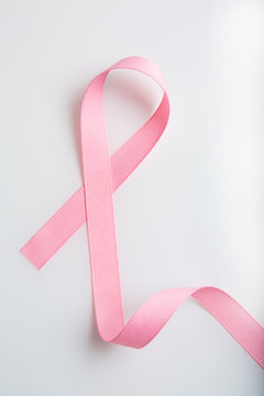 Pink colored ribbon isolated on white. Symbol of breast cancer awareness. healthcare and medicine concept. Preventive measures. Women health