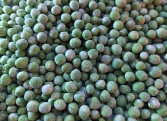 green frozen fresh peas background, texture
