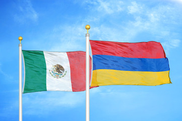 Mexico and Armenia  two flags on flagpoles and blue cloudy sky
