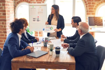 Group of business workers working together in a meeting. Listening one of them speaking at the office.