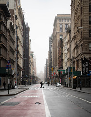 Empty New York City streets without people and closed shops during pandemic coronavirus outbreak in America. 