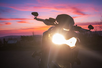 Sport Motorbike Headlights Against Twilight Sky