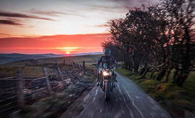 Motorcycle Ride Across Scenic Countryside at Sunrise