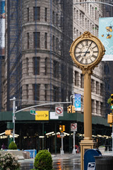 Fototapeta na wymiar Empty streets of New York City. Madison square garden with historical clock and iron building. Rainy days in new York city, Manhattan. 