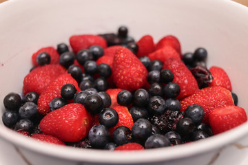Bluerries, strawberries and blackberries in a bowl