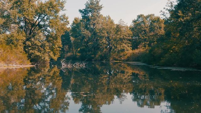 smooth forward movement of the boat along the mysterious river channel between the dangerous snags sticking out of the water. wrong turn left