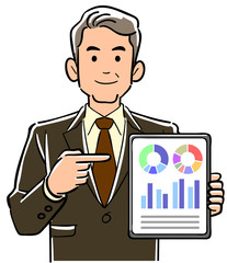 タブレットPCを指差し説明するスーツ姿の管理職男性