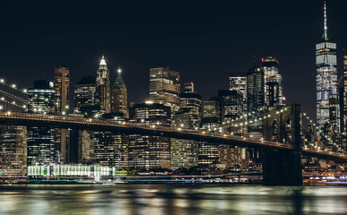 Fototapeta na wymiar New York City skyline night view. Brooklyn bridge night view. World Trade Center night view. 