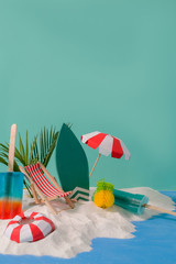 Cropped shot of summer vacation concept with beach accessories, ice-creams, summer fruits and sand