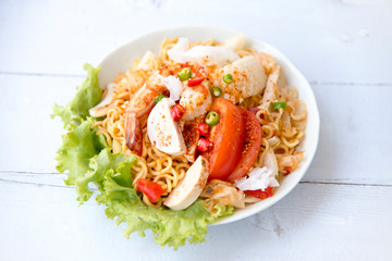 Instant noodle spicy salad with seafood and vegetable ,Spicy Noodle Salad,Mama Noodle Salad,Yum Mama,Thai Street Food Concept, Easy cook and fast. Instant noodle can do for easy dinner and good meal.