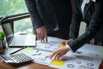 Team work process. Marketing strategy brainstorming. Paperwork and digital in office.Business team meeting and analyzing business financial document
