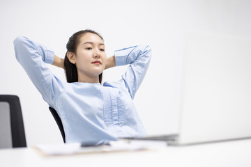 Asian young woman relaxing stretch oneself in breaking coffee time after working job finish