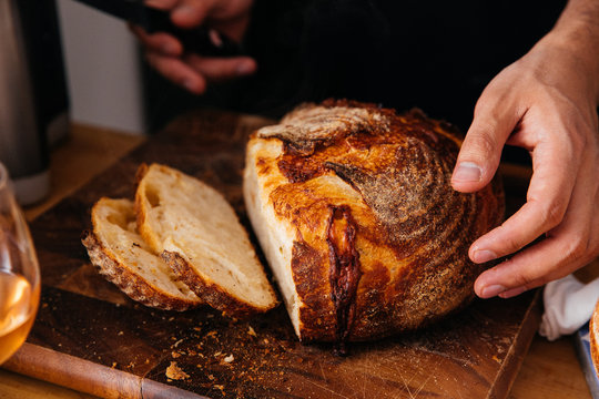 Slicing sourdough bread at home 