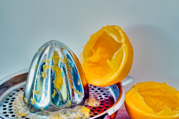 Fototapeta na wymiar citrus press with squeezed orange