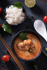 Tom Yum Goong Thai hot spicy soup with Ingredients on dark background