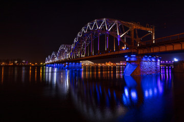 Illuminted railroad bridge in central Riga in Latvia