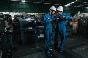 Industrial engineer men wearing uniform safety in factory working.