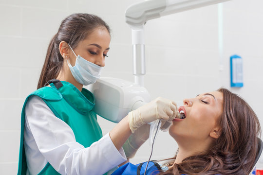Dentist x-ray. A woman having her teeth x-rayed