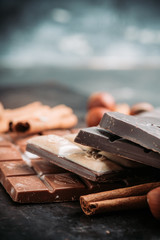 Chocolate bar on the rustic background. Selective focus. Shallow depth of field.