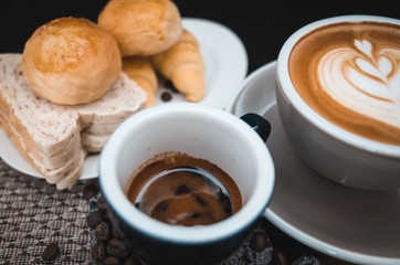 Closeup Coffee latte art with bread