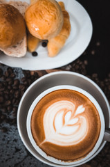 Closeup Coffee latte art with bread