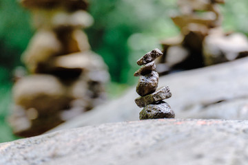 Pile of rock stacked in balance with each other to form a tower, an ancient ritual of good fortune and prosperity.