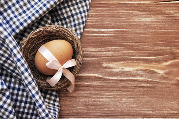Preparation for the Easter holiday. Eggs and Easter decor on a bright background