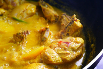 Malaysian Malays traditional cook called Ayam Masak Lemak Chili Padi. It is chicken cooked with a mixture of water, coconut milk, chili turmeric, and water.