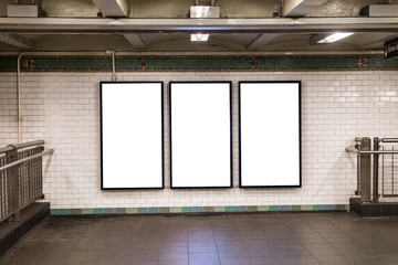 advertisement billboards electronic displays in a subway station in New York City - 334355362