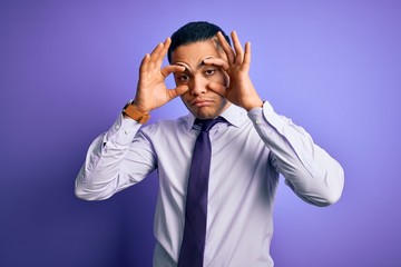 Young brazilian businessman wearing elegant tie standing over isolated purple background Trying to open eyes with fingers, sleepy and tired for morning fatigue