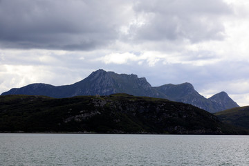 Scapa Flow - Orkney (Scotland), UK - August 11, 2018: The coastline view from ferry boat to Orkney, Orkney, Scotland, Highlands, United Kingdom