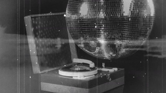 Vintage film of retro record player rotating.
