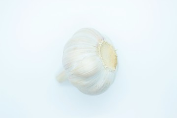 A head of garlic located on a white background